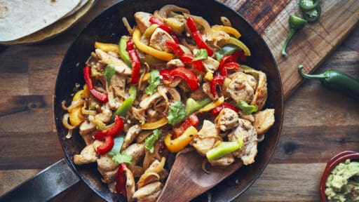 Fajitas de Pollo Chicken marinated Tortillas with Onions and Peppers