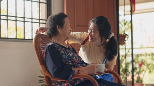 Asian granddaughter visiting her grandmother