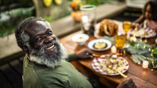 Portrait of a happy senior man during Christmas dinner at home