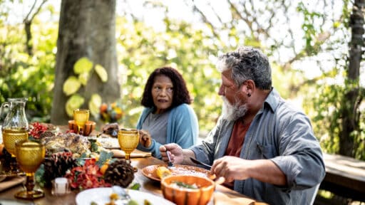 Senior couple eating lunch together at home